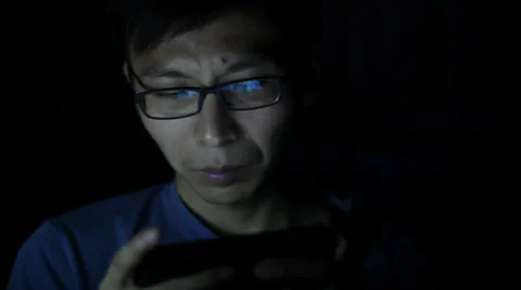 Man using smartphone at night Stock Footage 54304667