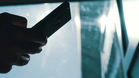 Man using smartphone outdoors closeup Stock Footage 127789839