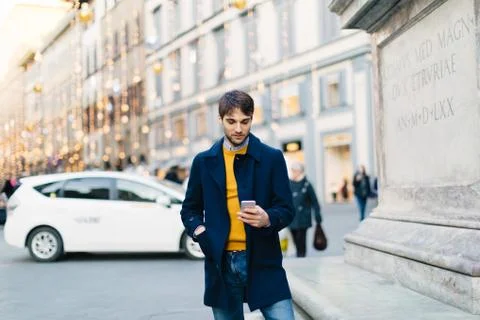 Man using smartphone at piazza, Firenze, Toscana, Italy Stock Photos