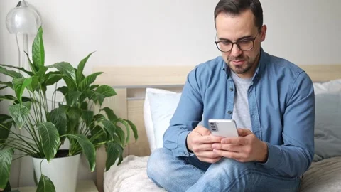 Man using smartphone pressing finger, reading social media internet Stock Footage 236921164