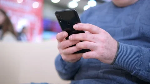 Man using smartphone pressing finger, reading social media internet, typing text Stock Footage 239412318
