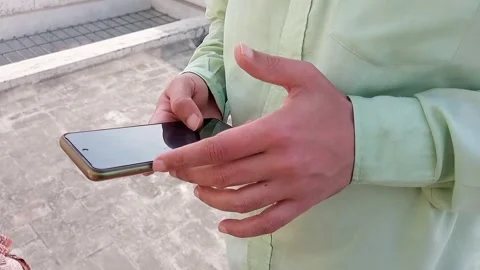 Man Using Smartphone on Rooftop in City, Mobile Technology Lifestyle, Video stock 328407634