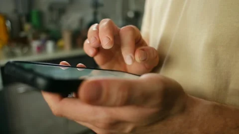 Man using smartphone scrolling and swiping on social media feed Video stock 321738984