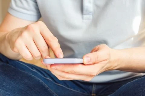 Man using smartphone scrolling through social media, doing swiping, scrolling Stock Photos