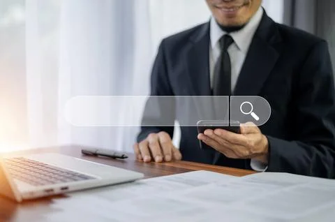 Man using smartphone search on internet mobile Stock Photos