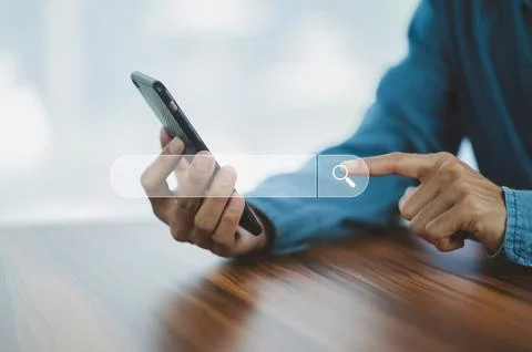 Man using smartphone search on internet mobile Stock Photos