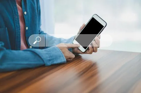 Man using smartphone search on internet mobile Stock Photos