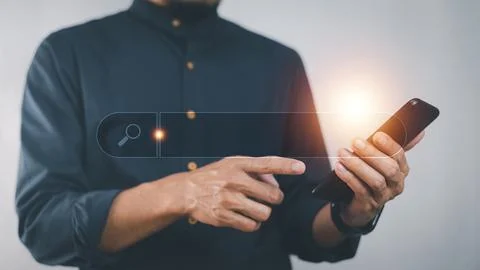 Man using smartphone search on internet mobile application Stock Photos