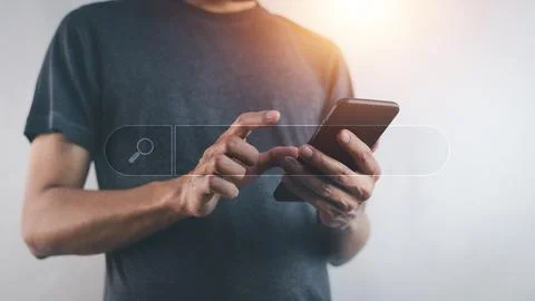 Man using smartphone search on internet mobile application Stock Photos