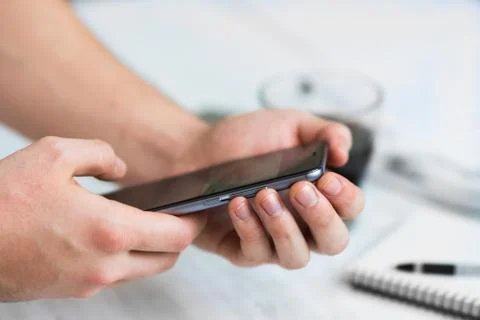 Man using smartphone a touch screen smart phone hands close up, vintage color Stock Photos