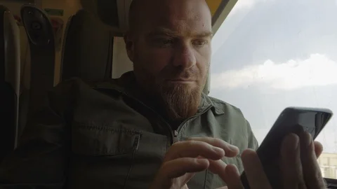 Man using smartphone on train. Travel,communication,technology Vídeo Stock 96341222