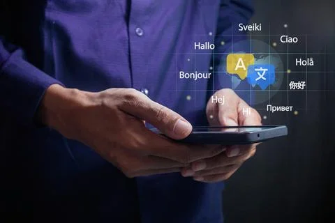 Man using a smartphone to translate different languages. Multilingual langu.. Stock Photos