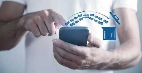 Man using smartphone. Trash can and files. Delete files Stock Photos