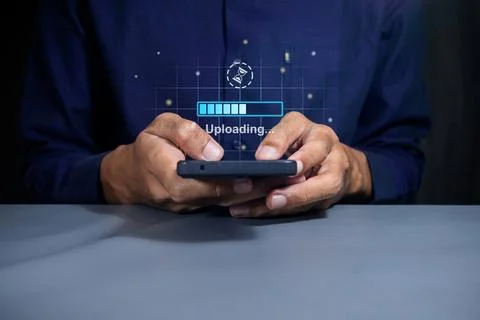 Man using a smartphone to upload data to cloud storage. Phone data backup a.. Stock Photos