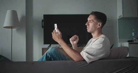 Man using smartphone for video chat, video bridging personal or professional Stock Footage 312123581