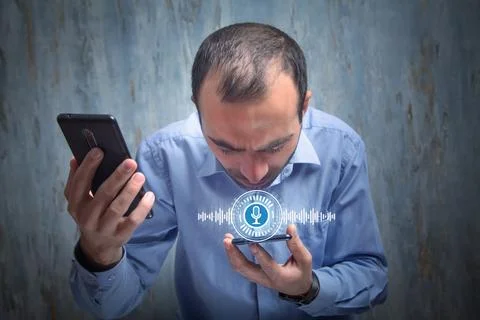 Man using smartphone. Voice Assistant Stock Photos