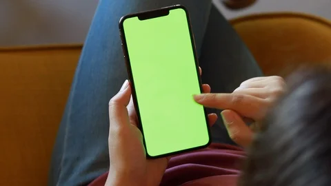 Man using smartphone watching green screen 4k Stock Footage 122197603