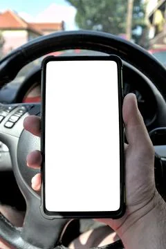 A man using a smartphone while driving a car. White screen template Foto stock