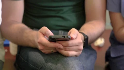 Man Using Smartphone While Sitting Indoors Close Up Stock-Footage 328997929