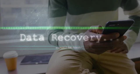 Man using smartphone by window, showing encrypted data transfer with progress Stock Footage 307438941