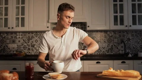 Man Using Smartwatch and Drinking Coffee Видео 103828818