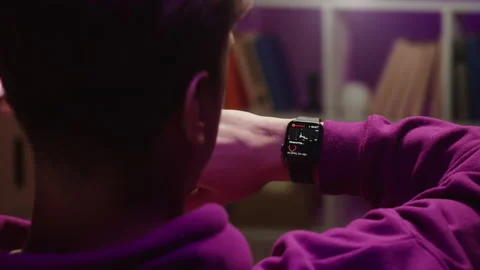 Man using smartwatch close-up. Young guy wearing fitness bracelet. Person Stock Footage 168991372