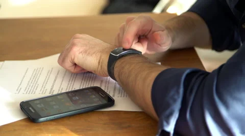 Man using smartwatch Stock Footage 63298393