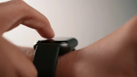 Man using smartwatch mobile app on touch screen Stock Footage 142120938