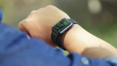 Man using smartwatch outdoor Stock Footage 80105072