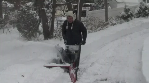 Man Using Snow Blower in Deep Snow 4 Stock Footage 586959