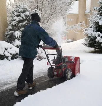 Man Using Snow Blower Stock Photos