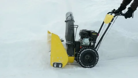 Man using snow plow machine to clear the road in winter closeup. 4K video. Stock Footage 171557521