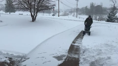 Man using snowblower on Driveway - Bettendorf, IA - Nov. 29, 2025 Stock Footage 322184280