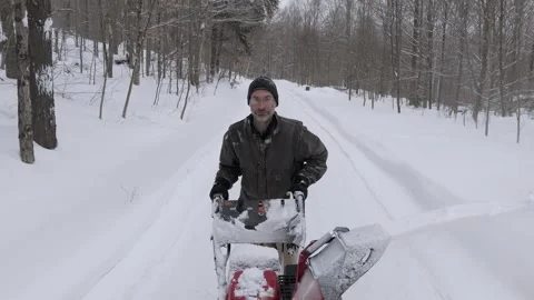 Man using snowblower Stock Footage 301875754