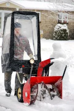 Man using snowblower Stock Photos