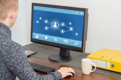 Man using social network on computer Stock Photos