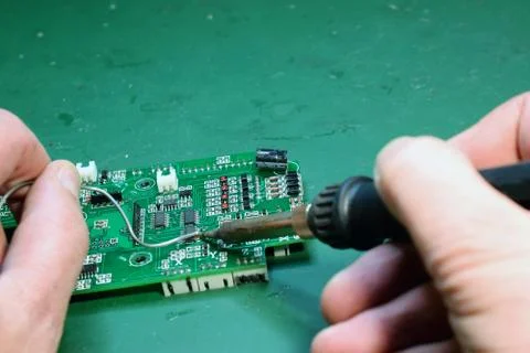 Man using soldering iron Stock Photos