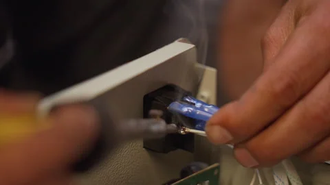Man using a soldering machine in a factory Stock Footage 289279398