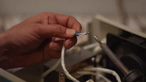 Man using a soldering machine in a factory Stock Footage 289279414
