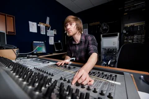 Man using a sound mixing desk Stock Photos