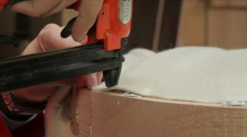 Man Using a Staple Gun on Wooden Chair 스톡 동영상 40329252