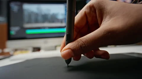 Man Using Stylus Pen on Digital Graphics Tablet Stock Footage 348346972