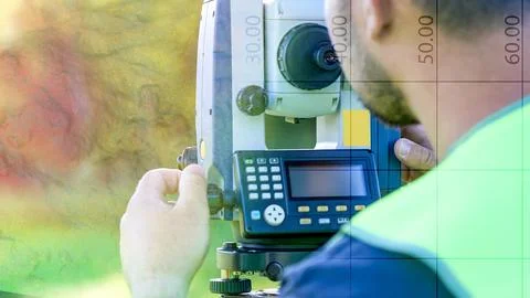 A man is using a surveying instrument Stock Photos
