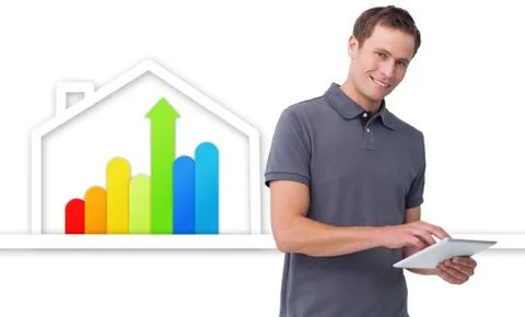 Man using tablet against energy efficient house graphic Stock Photos