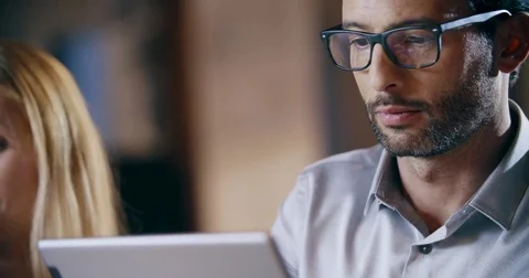 Man using tablet and eyeglasses.Corporate business team work office meeting 動画素材 78061047