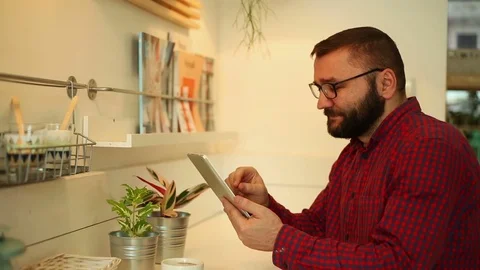 Man using tablet in the cafe, closeup Stock Footage 70861079