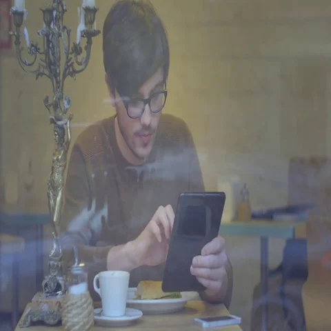 Man Using a Tablet in the Cafe Stock Footage 69423072