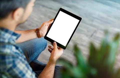 Man using tablet computer. Clipping path. Stock Photos