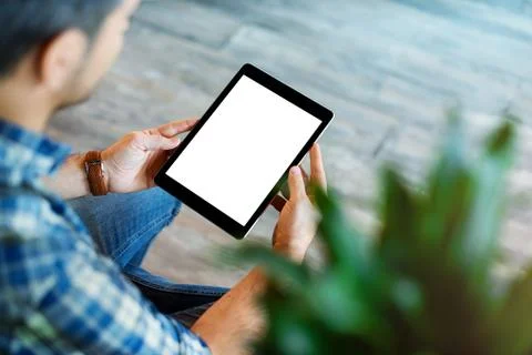 Man using tablet computer. Clipping path. Fotos de archivo