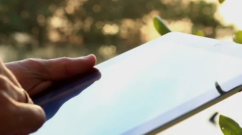 Man using tablet computer touchscreen in the morning. Stock Footage 65560385